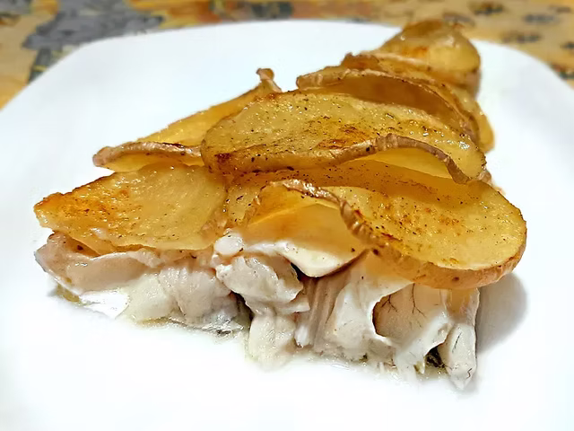 Branzino in crosta di patate gratinate al forno
