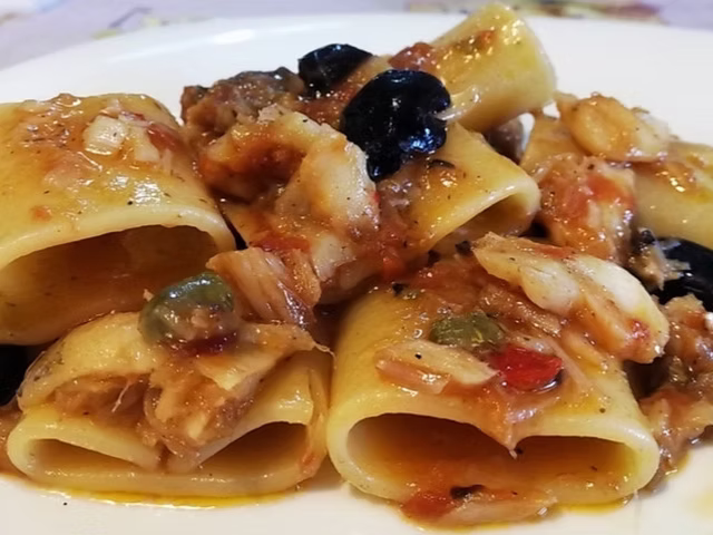 Paccheri con baccala*, olive taggiasche e capperi